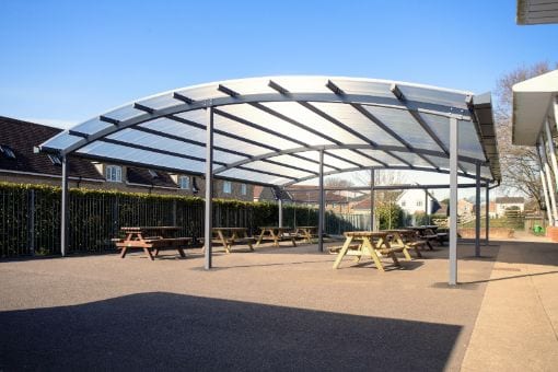 Curved roof dining shelter at Lincroft Academy